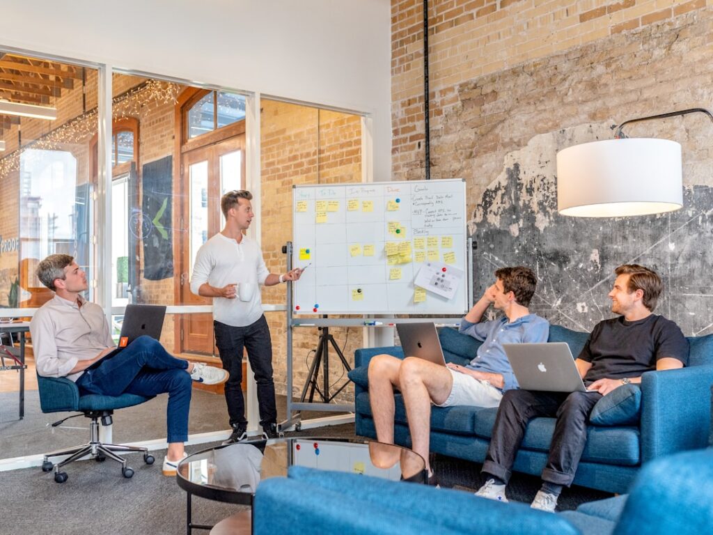 A group of professionals seated in a conference room streamlining communication and collaboration using relationship mapping tools